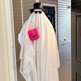 The essence of exceptional living person wearing a ghost costum