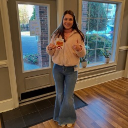a girl standing in front of a door