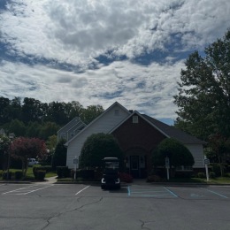 a building with a parking lot