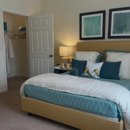 bedroom with a bed lamp and pictures on the wall