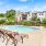 Large sparkling blue pool with a large pool deck and lounge chairs