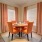 Large dining room with wood floors and large windows 