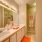 Large well lit bathroom with white accents 