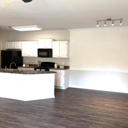 spacious kitchen area on wooden flooring